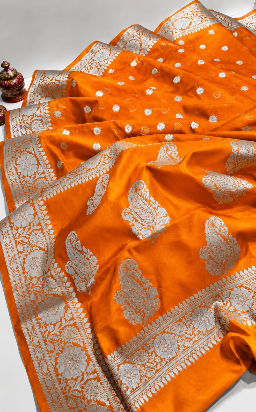 Elegant Orange Banarasi Silk Saree with Silver Zari Floral and Paisley Border