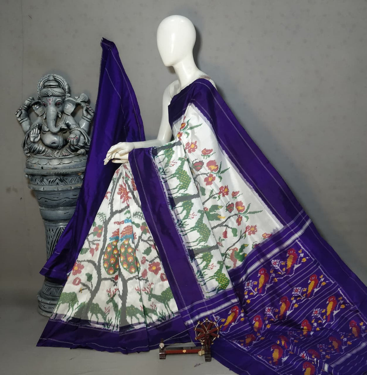 Royal white and Purple Handwoven Patola Silk Saree with Floral & Peacock Ikat Design