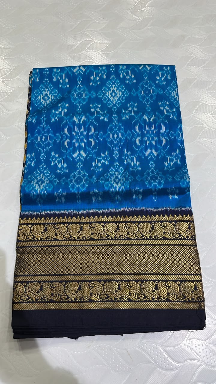 Pochampally Ikkat Silk Saree in Royal Blue with White Ikkat Patterns and Black Kanchi Border
