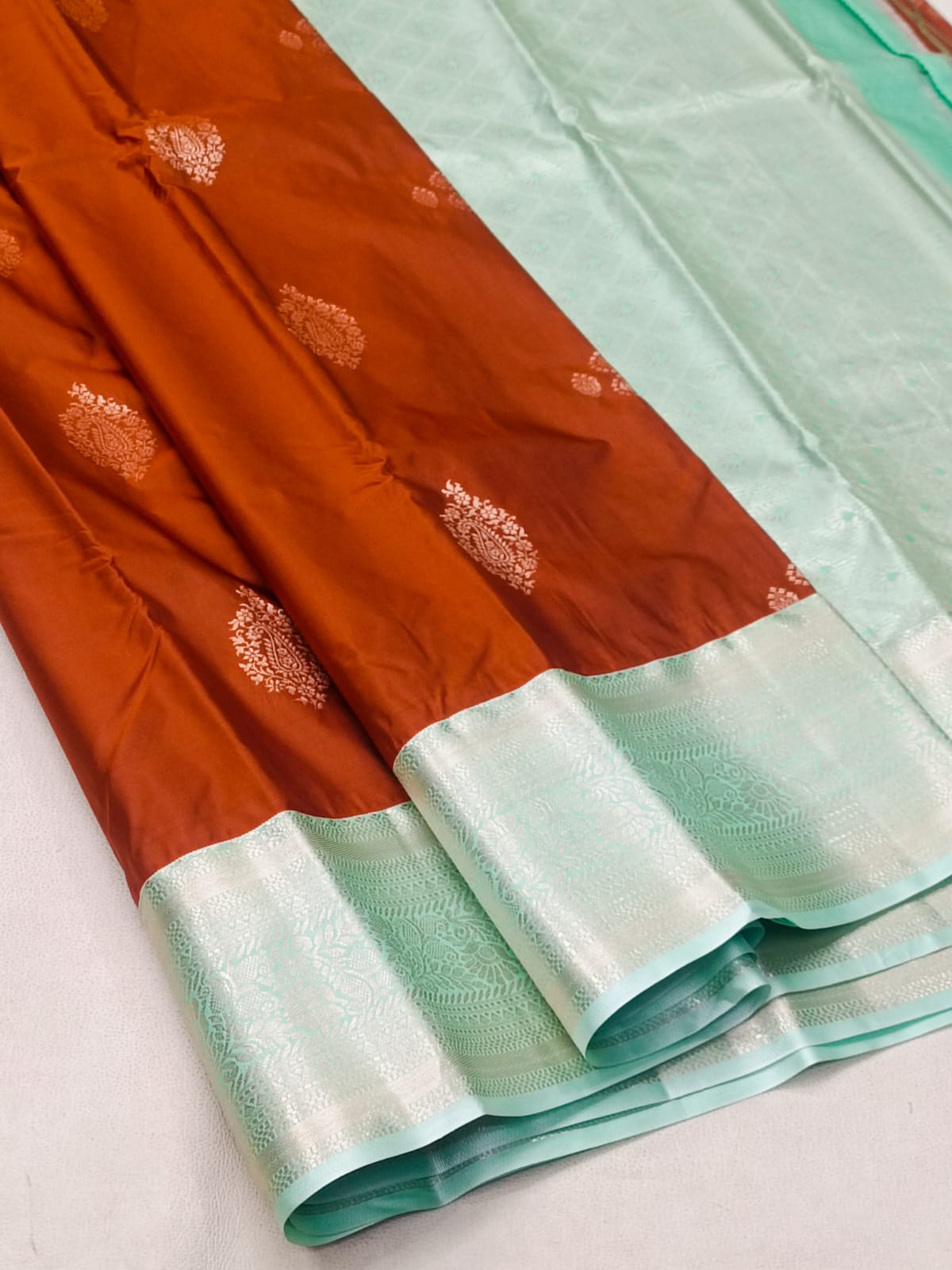 Kanchipuram Semi Silk Saree - Copper Orange & Pastel Sea Green with Zari Motifs
