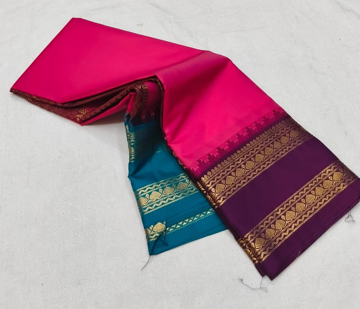 Elegant Magenta and Purple Silk Saree with Contrast Teal Pallu and Golden Zari Border