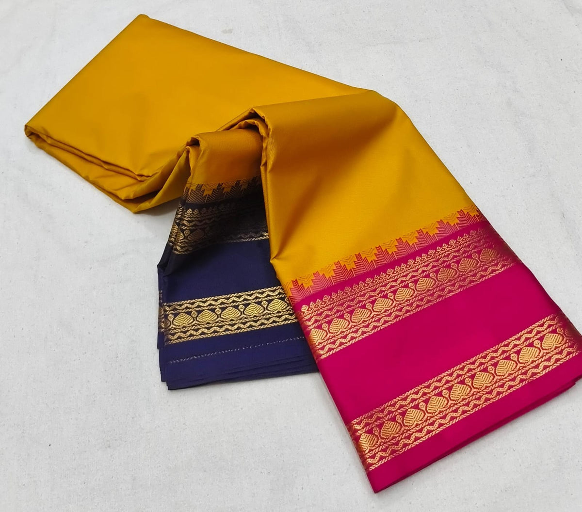 Mustard Yellow Ganga Jamuna silk saree with Pink and blue borders