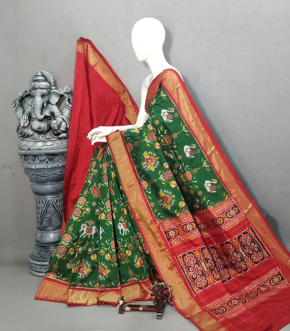 Bottle Green Handwoven Patola Silk Saree with Traditional Ikat Motifs & Rich Red Zari Pallu