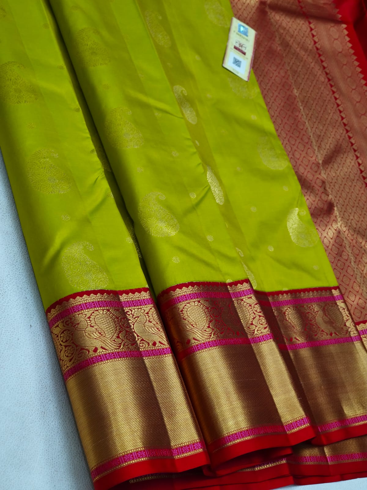 Lime Green Kanchipuram Silk Saree with Gold Paisley Zari & Pink Temple Border
