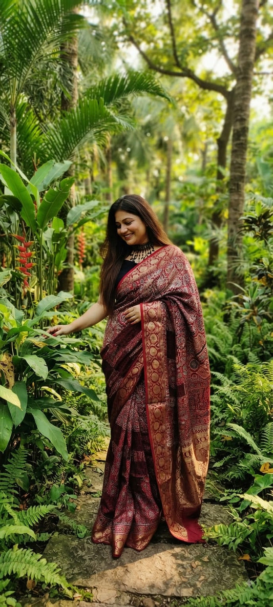 Pure Dola Silk Ajrakh Natural Hand Block Printed Saree in Deep Crimson & Maroon Floral Jaal with Woven Gold Zari Border