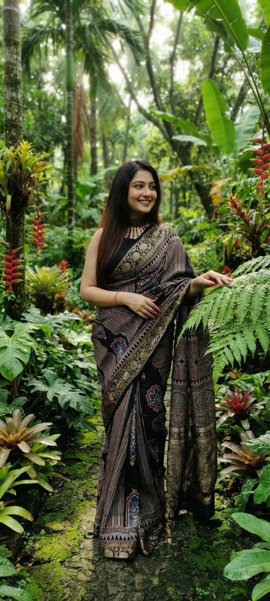 Pure Dola Silk Ajrakh Natural Hand Block Printed Saree in Black with & Floral Arch Motifs and Woven Zari Border