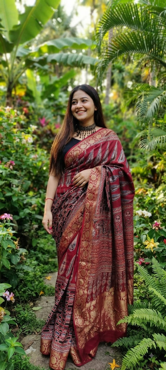 Pure Dola Silk Ajrakh Natural Hand Block Printed Saree in Maroon Red with Large Paisley Leaf Motifs & Woven Zari Border