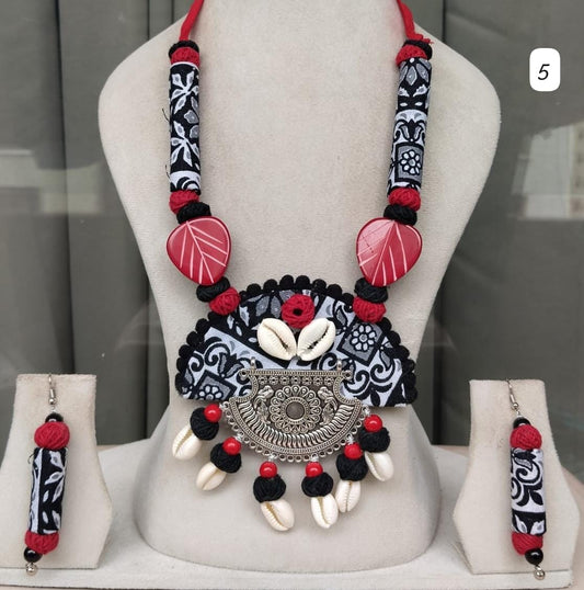 Come fall in love with this boho style handmade necklace with cowrie shells and matching earrings