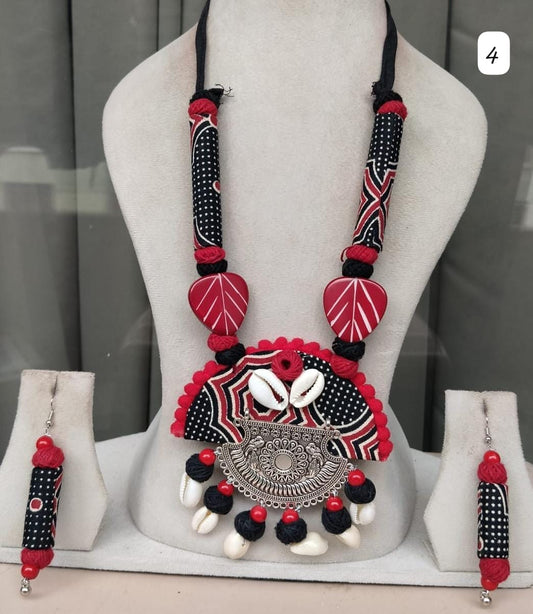 Come fall in love with this boho style handmade necklace with cowrie shells and matching earrings 
