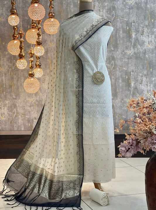 Exclusive Banarasi Mercerised Unstitched Salwar Kameez – Off-White & BlackBorder Resham Weaving with Lurex Dupatta